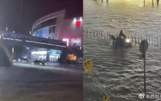 广东暴雨：街头积水市民骑车如渡河 官方提醒未来三天雨势持续